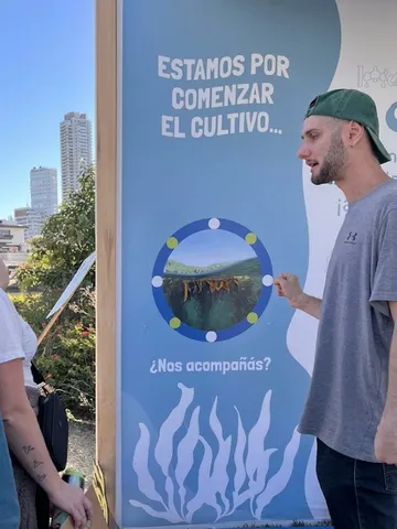 Team member at a hydroponics outreach mural