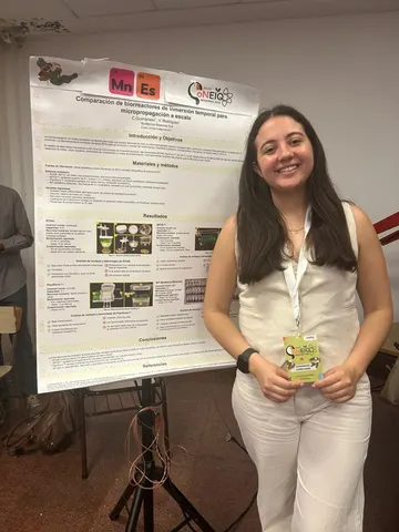 Team member presenting a research poster